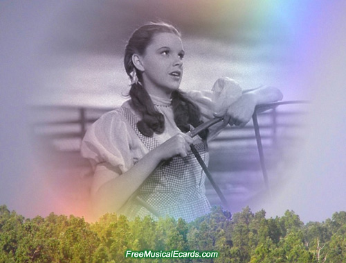 Judy Garland as Dorothy singing Somewhere Over the Rainbow in a barnyard