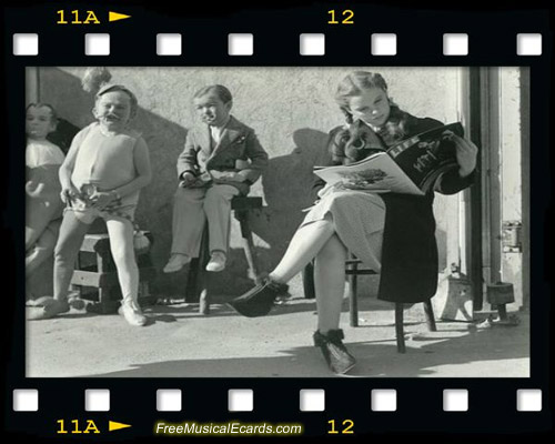 Judy Garland as Dorothy reading a magazine