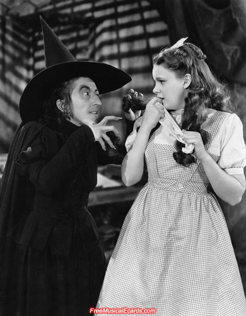 Judy Garland as Dorothy and Margaret Hamilton as The Wicked Witch in The Wizard of Oz