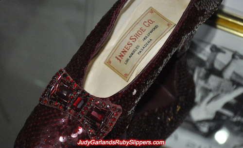 The bow and label of Judy Garland's size 5.5 replica ruby slippers