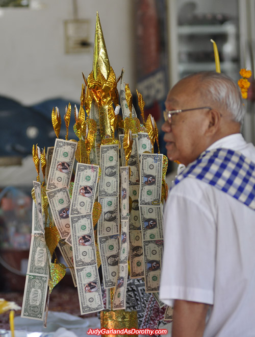 An elderly man is the chief of Judy Garland's money tree