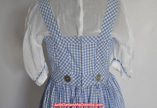 Back of Judy Garland as Dorothy's gingham pinafore dress