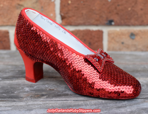 Beautiful sewing the sequins on Judy Garland's ruby slippers