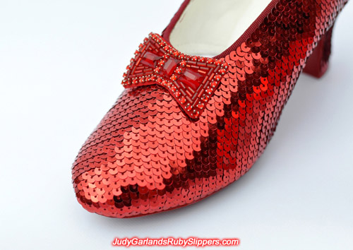 Closeup of the bow and toe on Judy Garland's ruby slippers