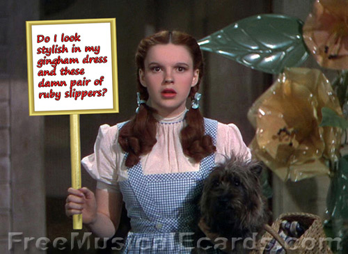 Judy Garland as Dorothy holding up a sign