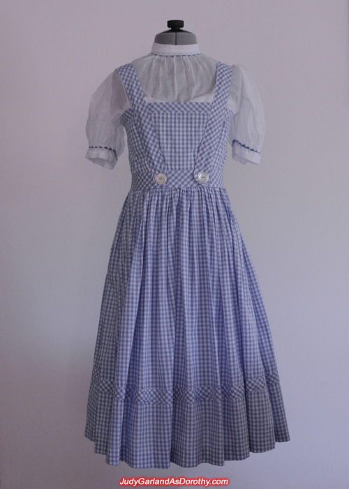 Judy Garland's blue-and-white checked gingham pinafore dress over a white puffy-sleeved blouse