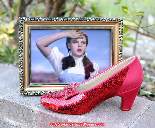 Sequining the right shoe is nearly finished on Judy Garland's ruby slippers