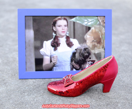 Sequining the right shoe is nearly finished on Judy Garland's ruby slippers