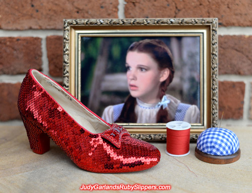 Sewing on the right shoe of Judy Garland's ruby slippers is finished