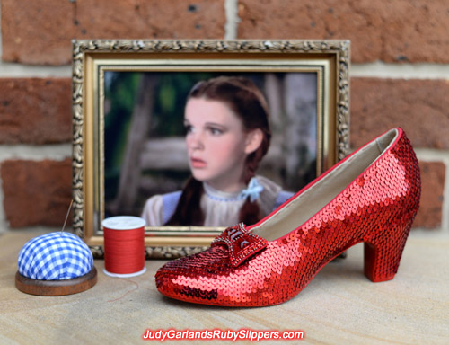 Sewing on the right shoe of Judy Garland's ruby slippers is finished