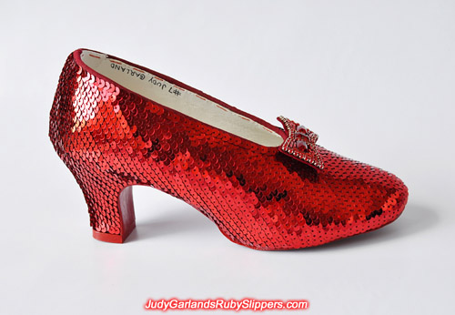 The right shoe of the ruby slippers is covered with sequins