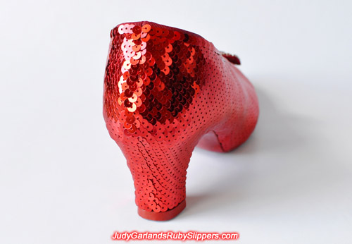 The right shoe of the ruby slippers is covered with sequins