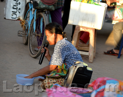 Begging on the streets of Vientiane, Laos