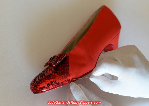 Sequining continues on Judy Garland's ruby slippers