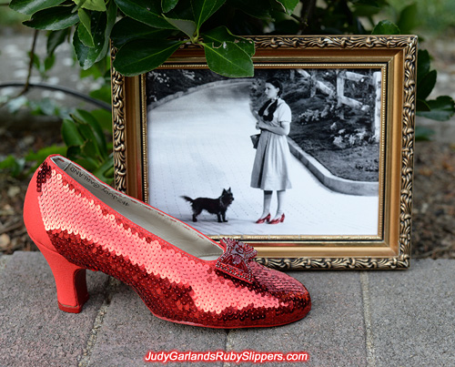 Sequining is in progress on the right shoe of the ruby slippers