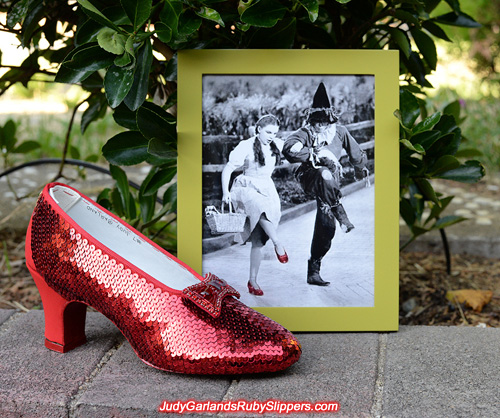 Sequining is underway on the right shoe of Judy Garland's ruby slippers