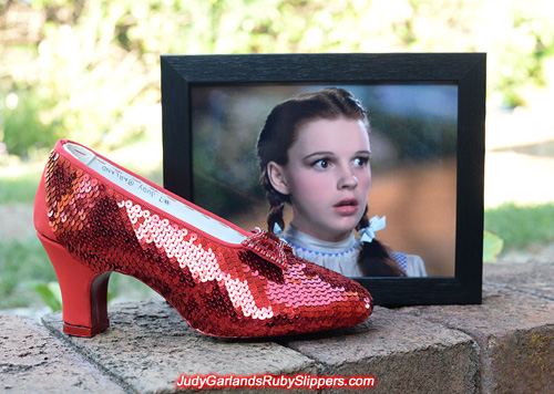 Sequining is underway on the right shoe of Judy Garland's ruby slippers