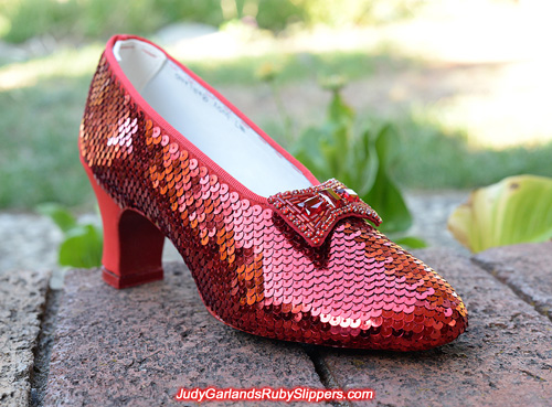 Sequining is underway on the right shoe of Judy Garland's ruby slippers