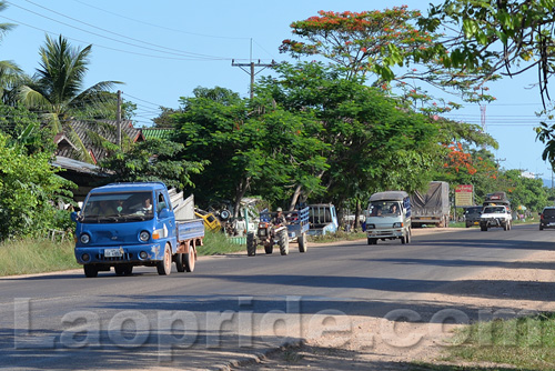 Tractors traveling on the outskirts of Vientiane, Laos