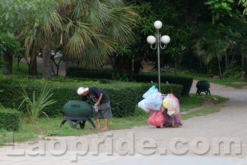 Vietnamese man collecting cans and bottles in Vientiane, Laos