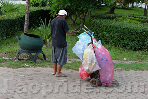 Vietnamese man collecting cans and bottles in Vientiane, Laos