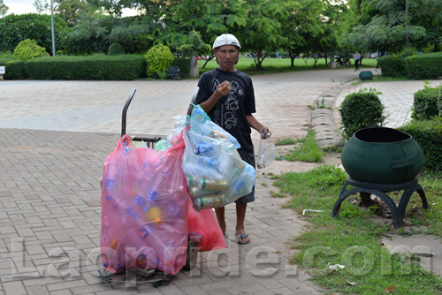 Vietnamese man collecting cans and bottles in Vientiane, Laos