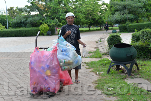 Vietnamese man collecting cans and bottles in Vientiane, Laos