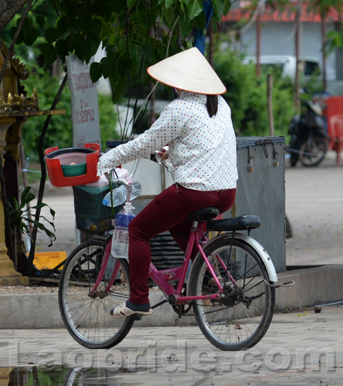 Vietnamese women working on bicycles in Vientiane, Laos