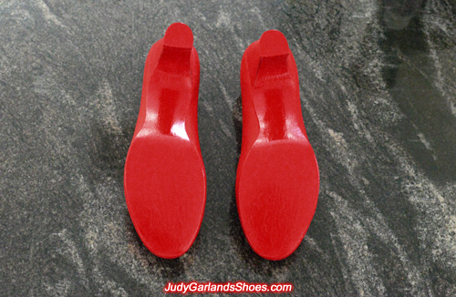 Glossy red soles under Judy Garland's size 5B shoes