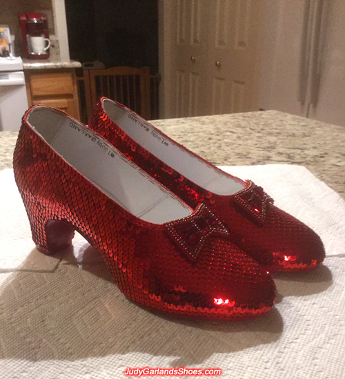 Hand-sewn ruby slippers at their new home