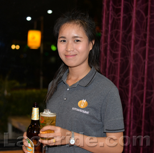 Lao beer serving girl in Vientiane, Laos