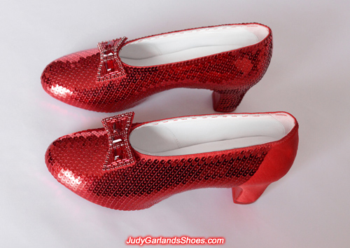 Sewing the sequins continues on Judy Garland's ruby slippers