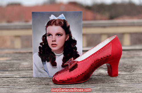 Sewing the sequins on the shoe with attention to detail