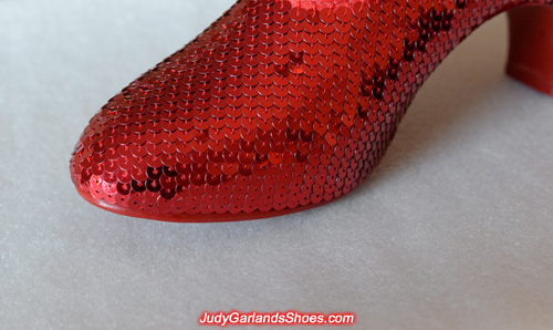 Working on the right shoe of Judy Garland's ruby slippers