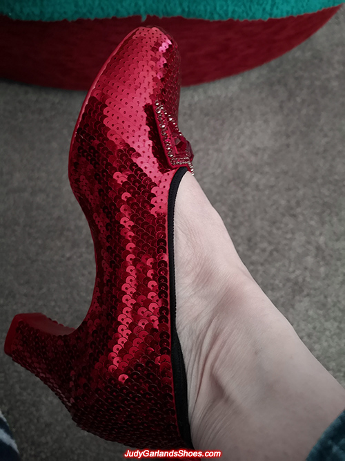 Woman wearing her size 6 ruby slippers